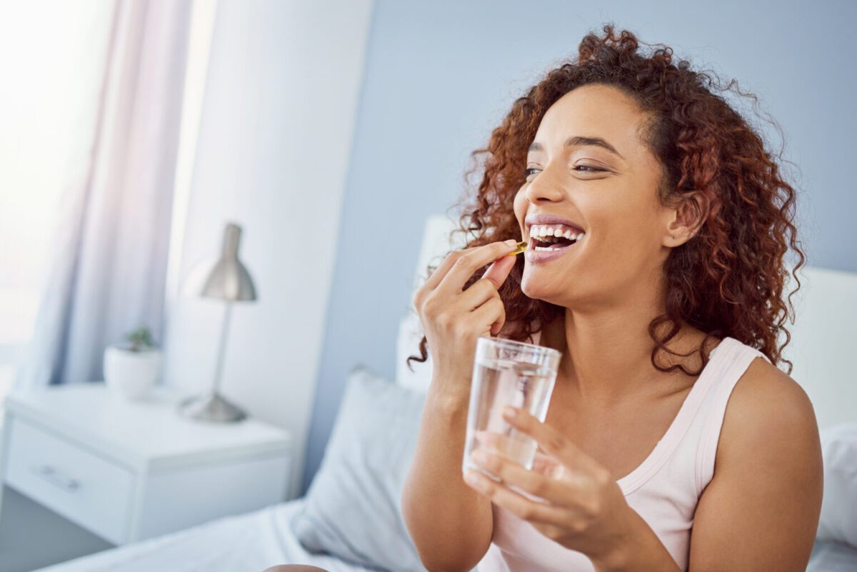 Taking her daily vitamins with a smile