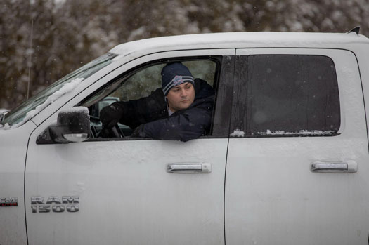 Plow driving with truck window open